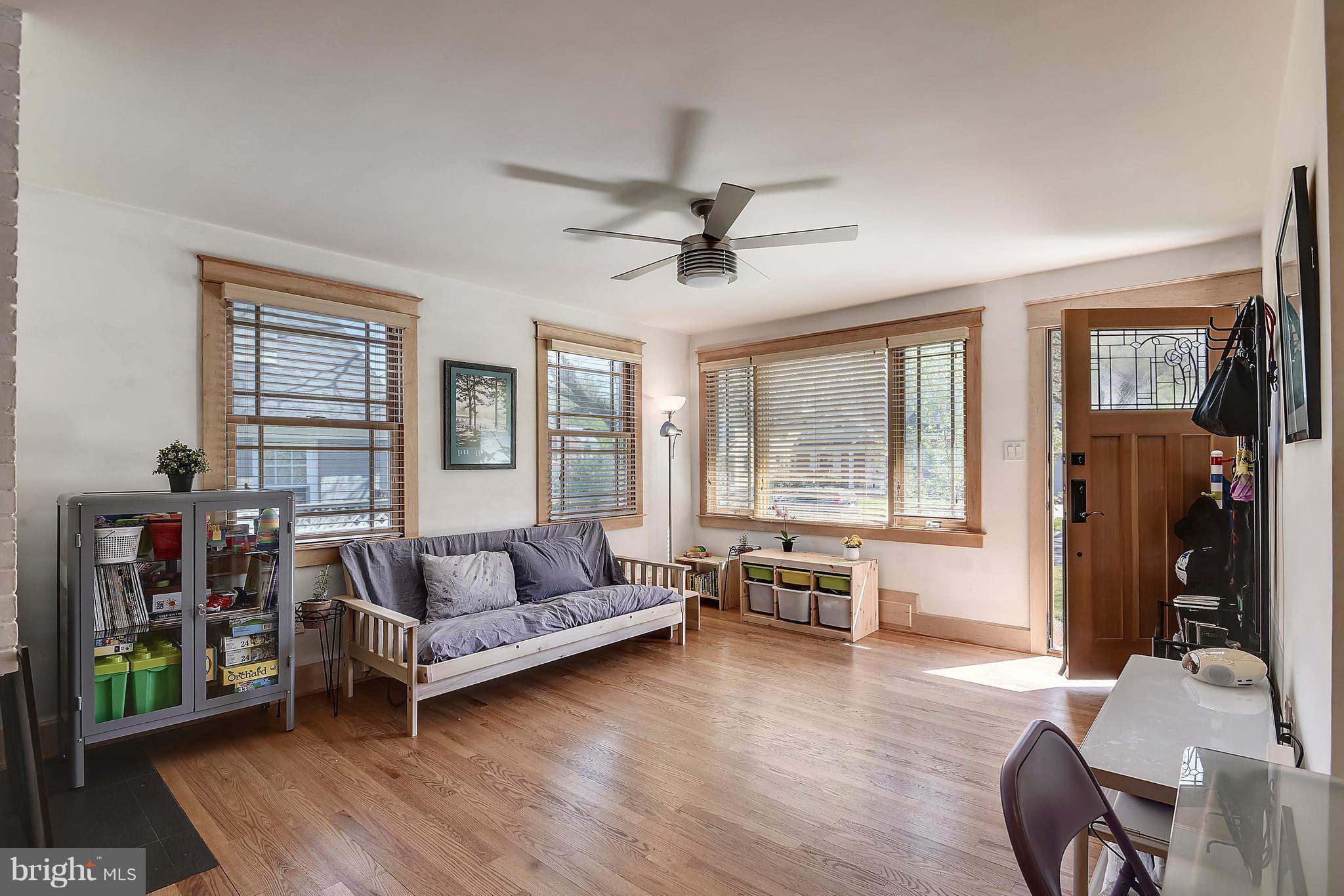 8716 Ridge Road Bethesda, MD 20817 - Photo 8 of 28 Light-Filled Living Room with Ceiling Fan