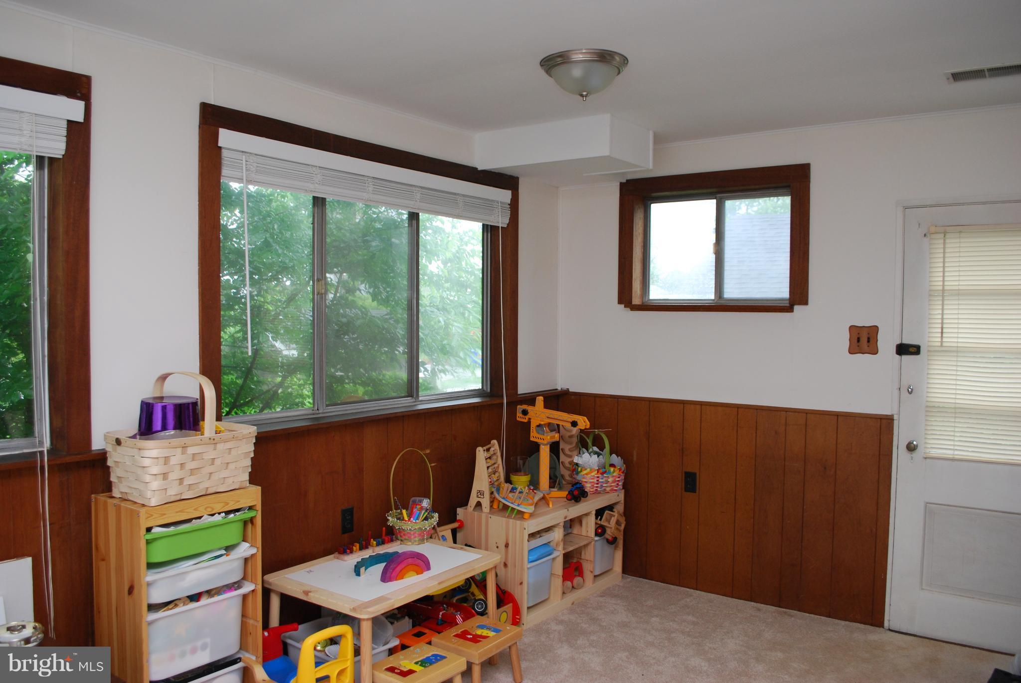 8716 Ridge Road Bethesda, MD 20817 - Photo 9 of 28 Sun-Filled Family Room with Pass Thru to Kitchen