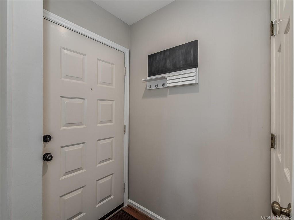 222 Queens Road, Unit 54 Charlotte, NC 28204 - Photo 2 of 18 a view of a livingroom with wooden floor