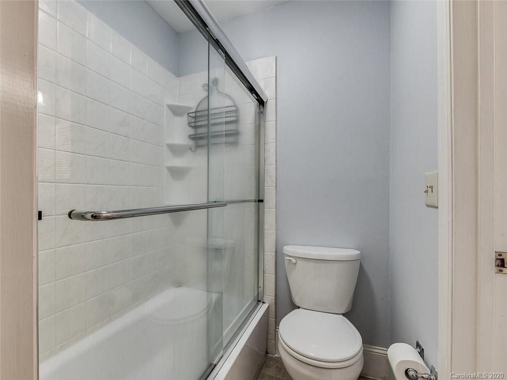 222 Queens Road, Unit 54 Charlotte, NC 28204 - Photo 13 of 18 a bathroom with a toilet and a shower