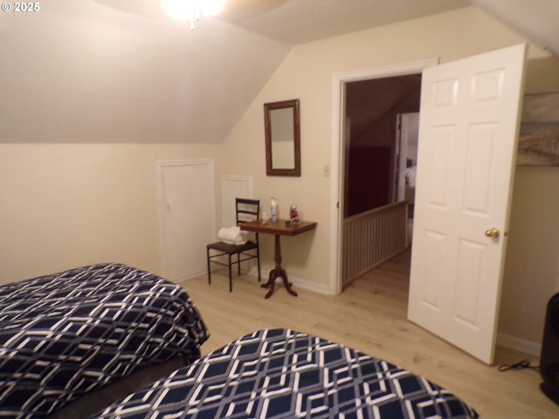 960 Shipping Street Northeast Salem, OR 97301 - Photo 16 of 29 a bedroom with a bed and a table in it