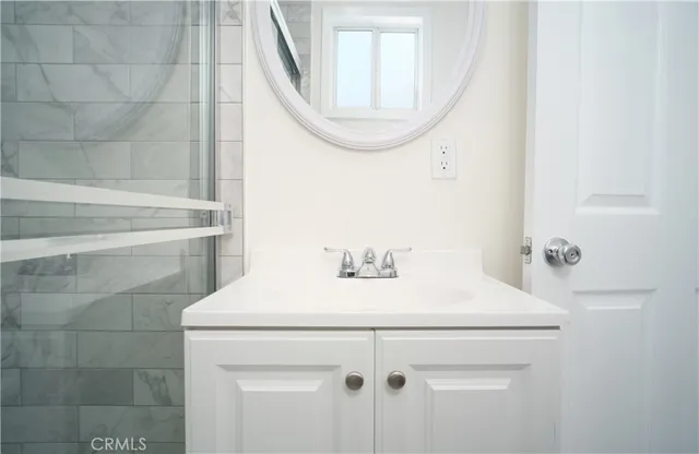 a bathroom with a sink and a mirror