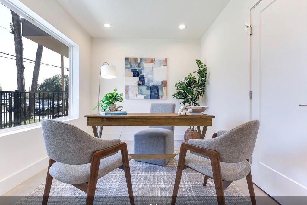 1902 North Carroll Avenue, Unit 102 Dallas, TX 75204 - Photo 11 of 29 a view of a dining room with furniture wooden floor and a potted plant
