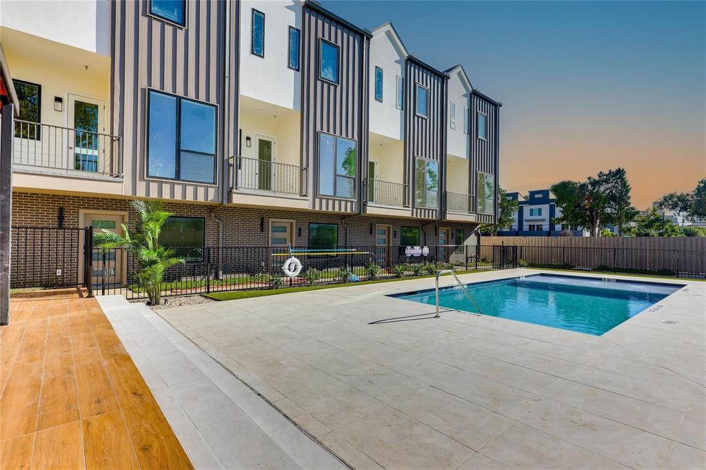 1902 North Carroll Avenue, Unit 102 Dallas, TX 75204 - Photo 6 of 29 a view of a swimming pool with a lounge chairs