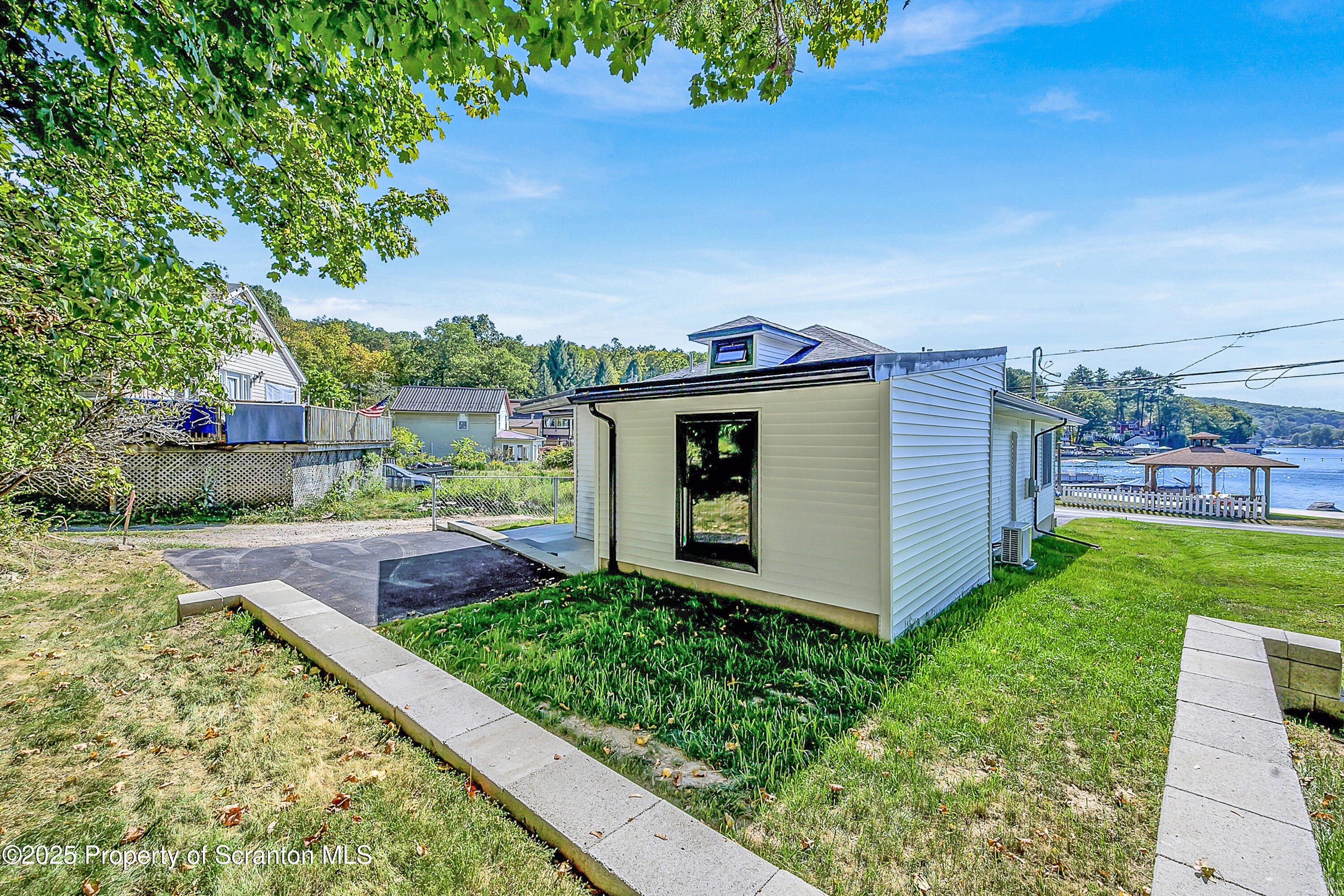 1262 Lake Road Lake Winola, PA 18419 - Photo 11 of 33 a front view of a house with garden