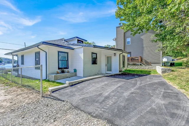 an empty room with windows and entrance