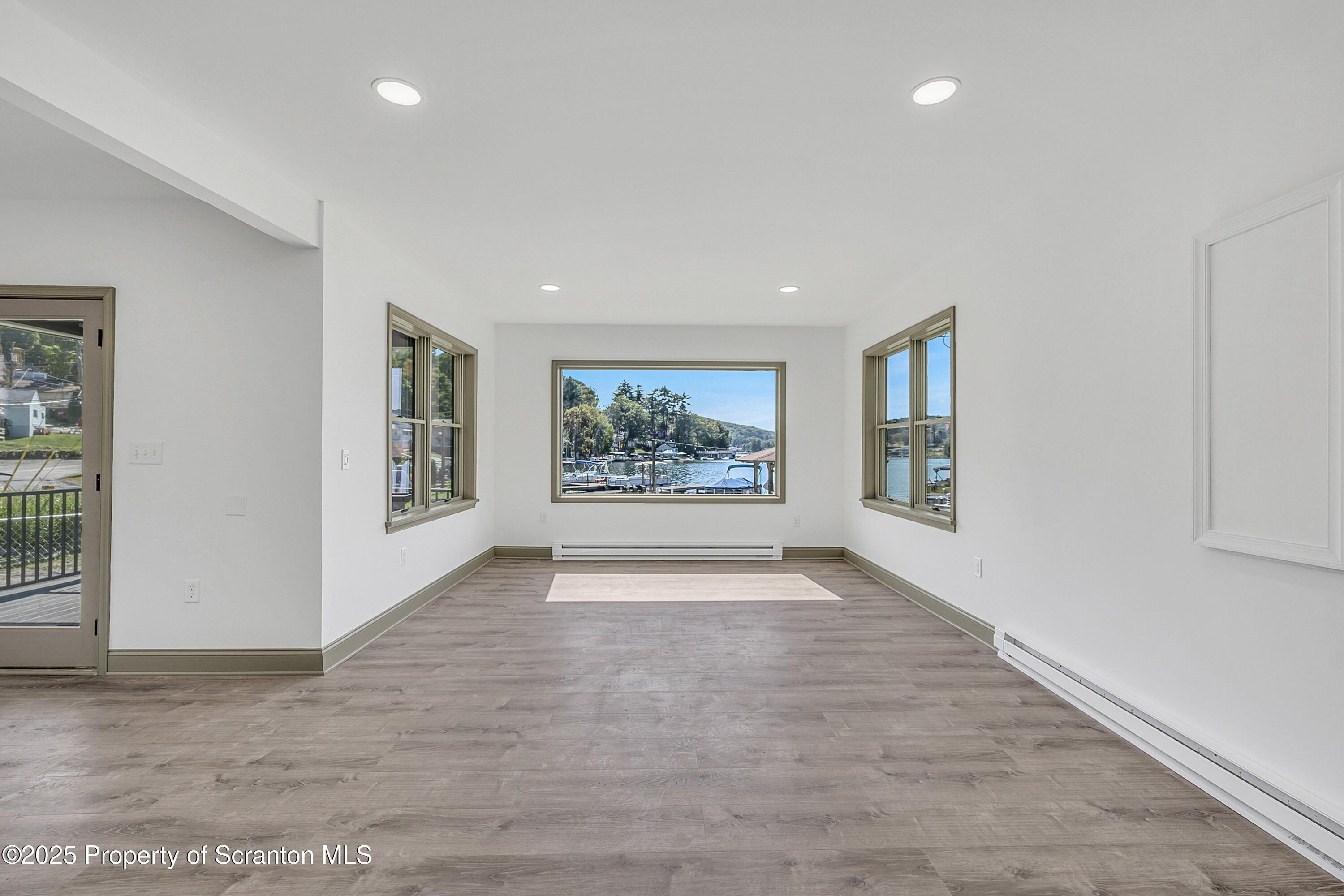 1262 Lake Road Lake Winola, PA 18419 - Photo 13 of 33 an empty room with windows and entrance