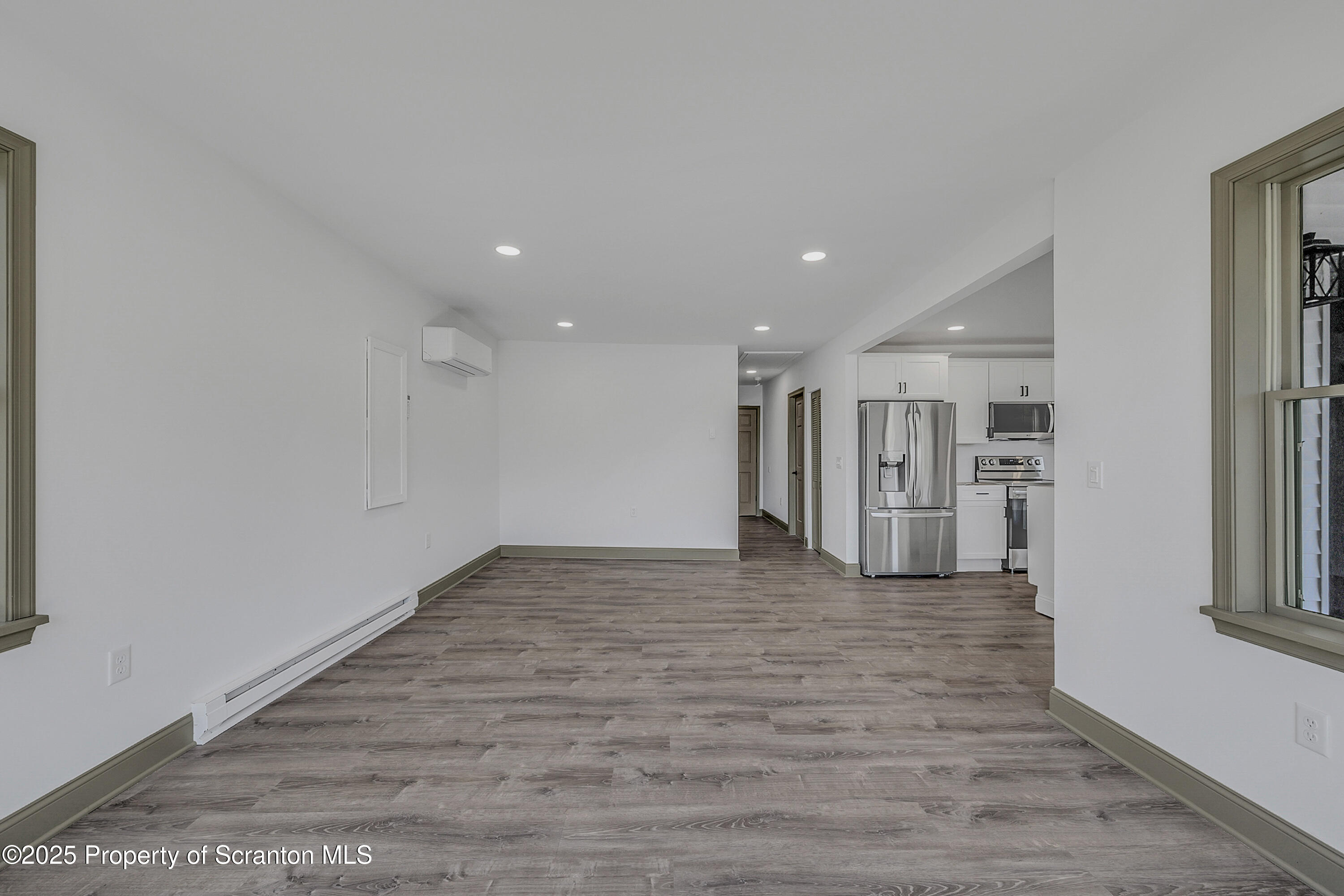 1262 Lake Road Lake Winola, PA 18419 - Photo 15 of 33 a view of a big room with wooden floor and windows
