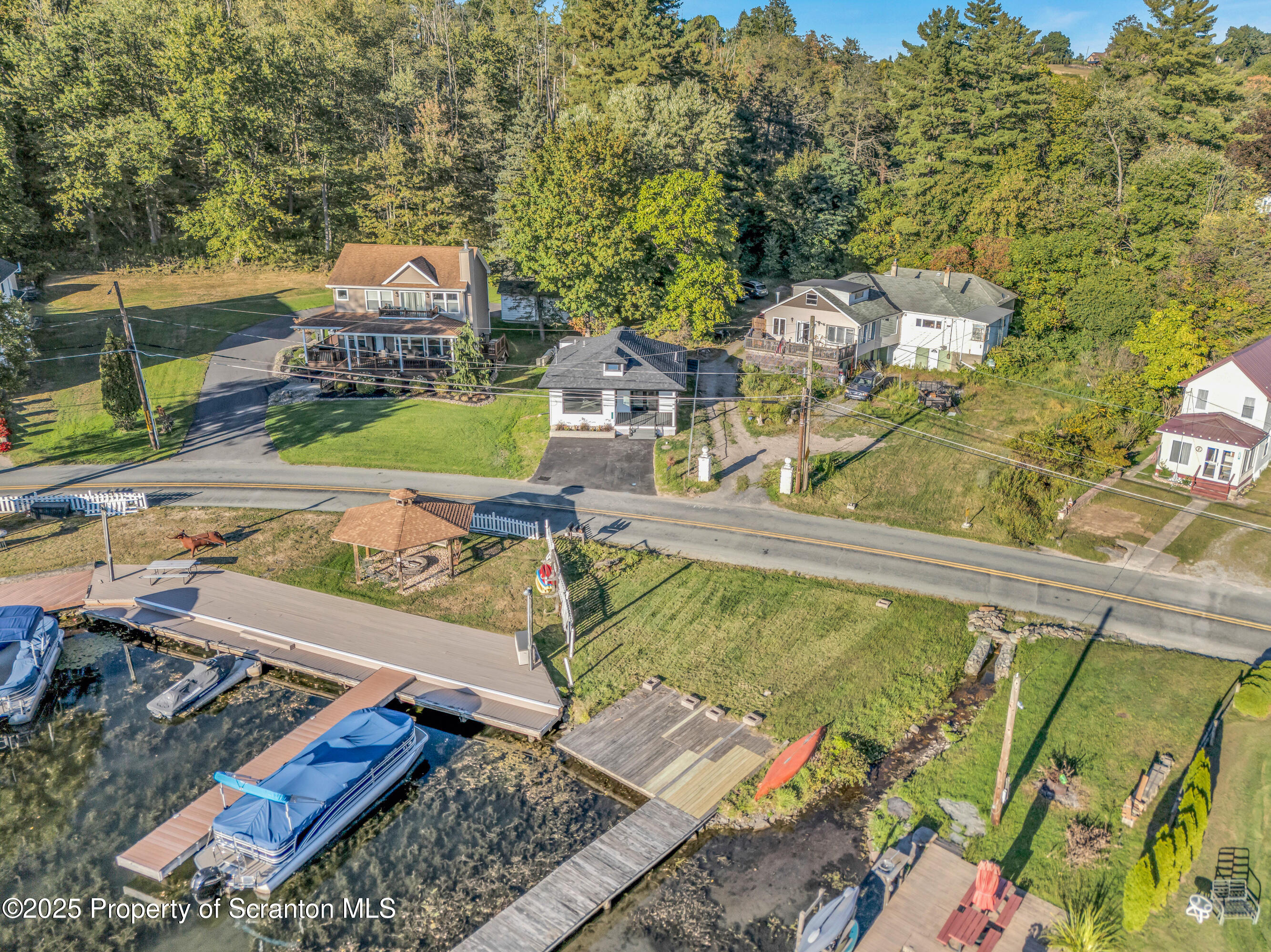 1262 Lake Road Lake Winola, PA 18419 - Photo 2 of 33 a view of a swimming pool with a lounge chairs