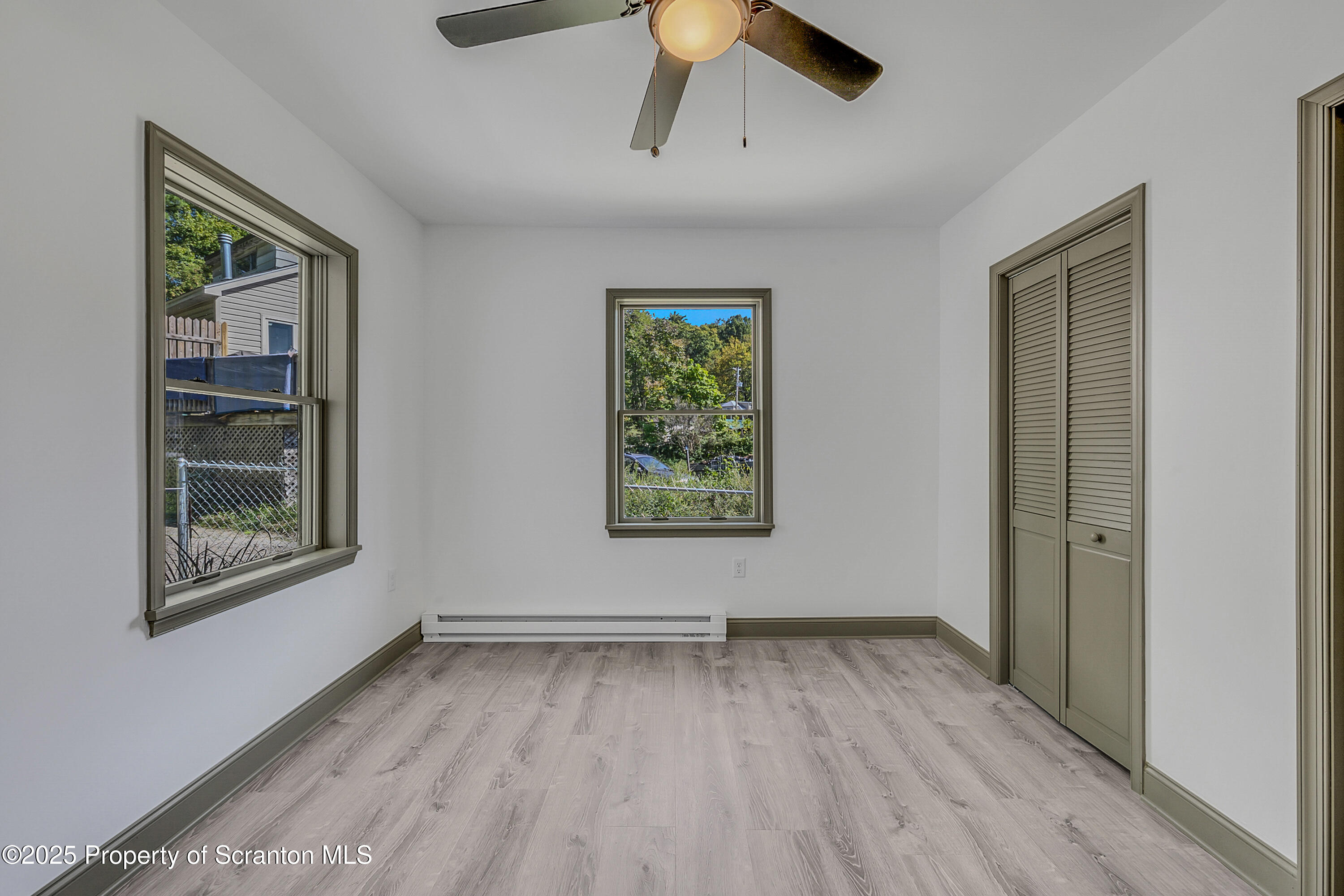 1262 Lake Road Lake Winola, PA 18419 - Photo 22 of 33 wooden floor in an empty room with a window