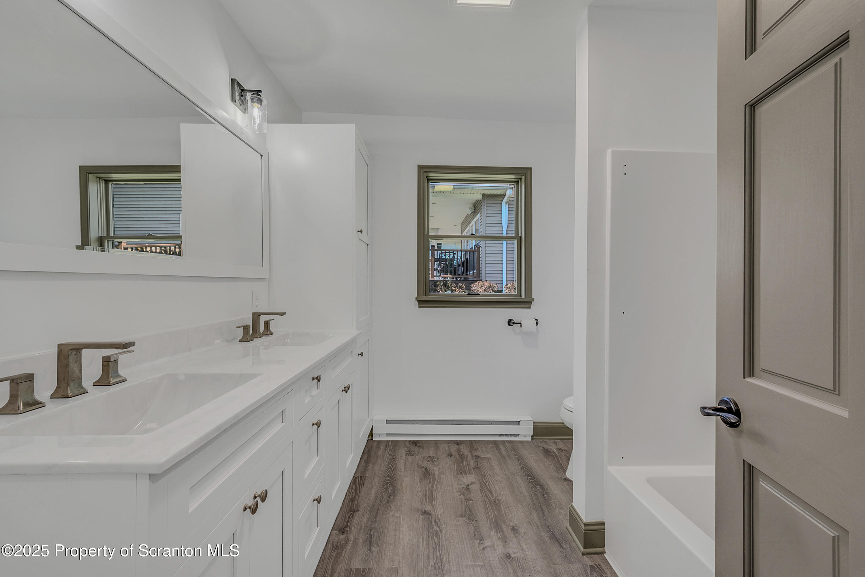1262 Lake Road Lake Winola, PA 18419 - Photo 23 of 33 a bathroom with a sink and a bathtub