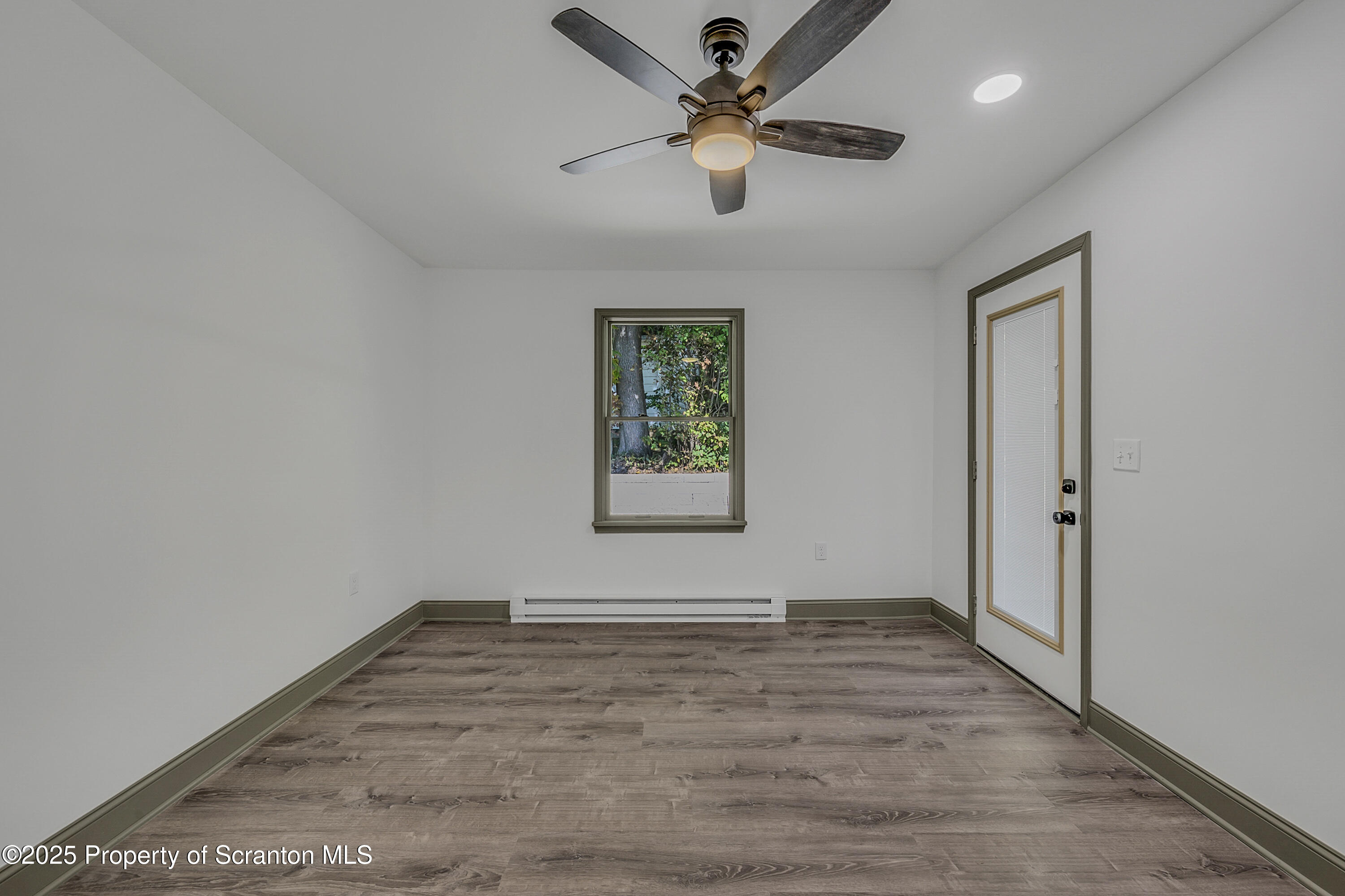 1262 Lake Road Lake Winola, PA 18419 - Photo 27 of 33 an empty room with fan and windows