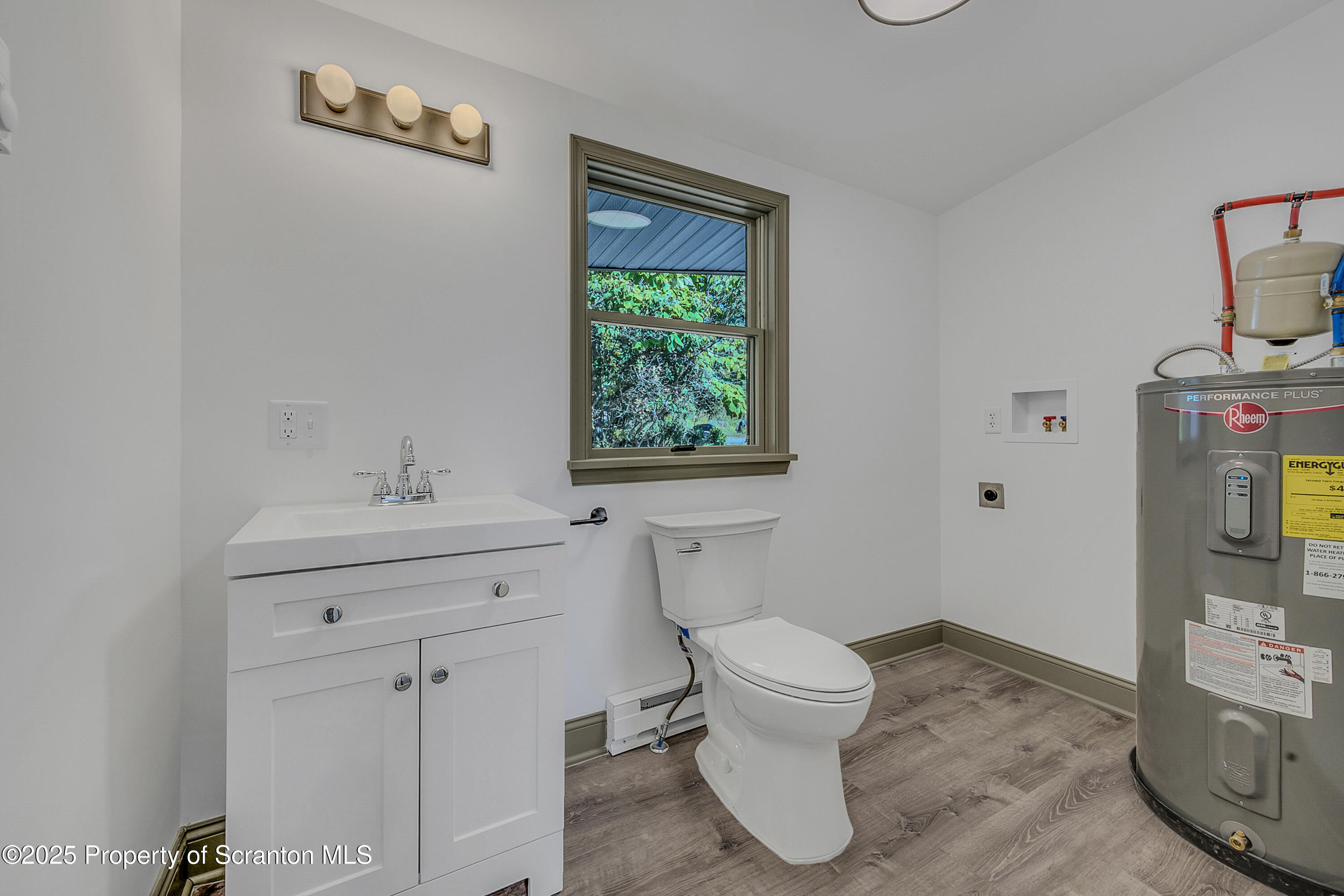 1262 Lake Road Lake Winola, PA 18419 - Photo 29 of 33 a bathroom with a toilet sink and mirror