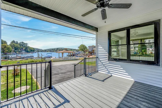 a view of balcony with wooden floor