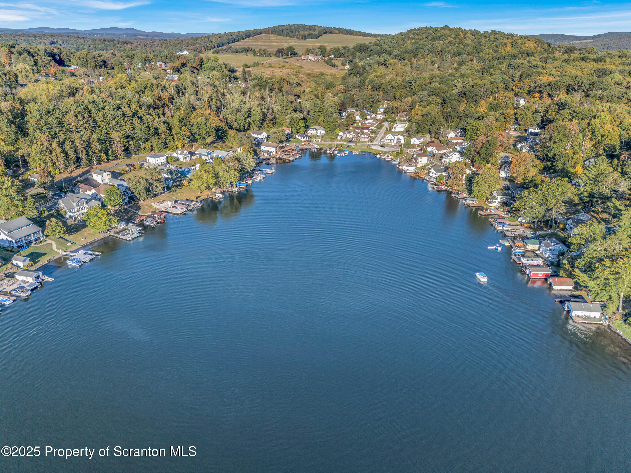 1262 Lake Road Lake Winola, PA 18419 - Photo 8 of 33 an aerial view of a city with mountains