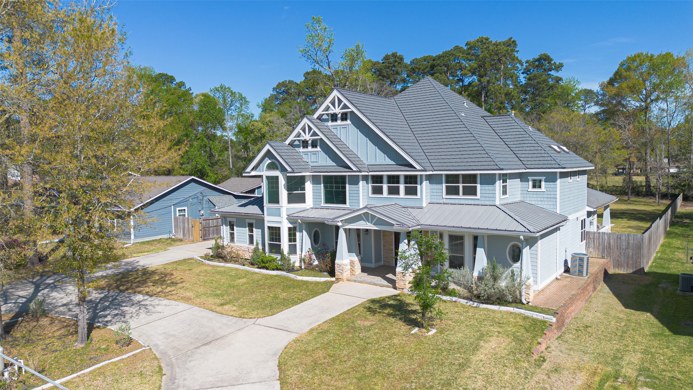 2504 Southline Road Conroe, TX 77384 - Photo 3 of 26 a house with trees in the background