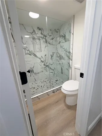 a bathroom with a bathtub and shower