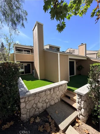 a view of a terrace with yard