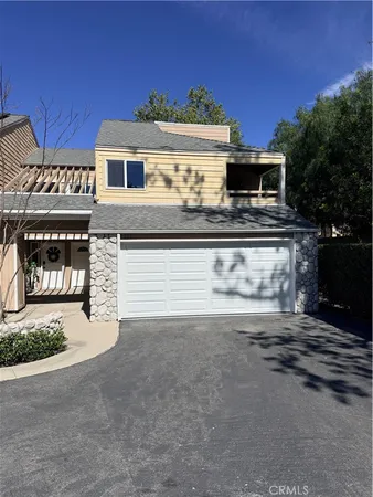 a front view of a house with parking