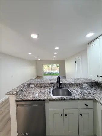 a view of fireplace and wooden floor