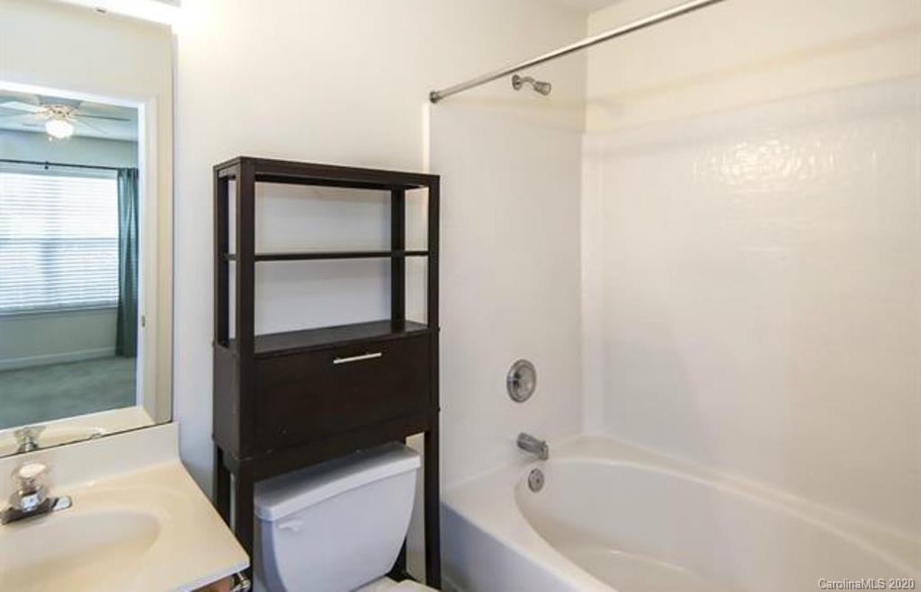 3010 Rugged Stone Way Charlotte, NC 28227 - Photo 3 of 4 a bathroom with a sink and a tub