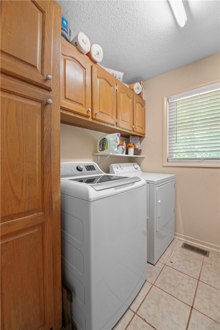 106 Farmgate Road Pickens, SC 29671 - Photo 18 of 38 This laundry area gives plenty of space for washing clothes and storage