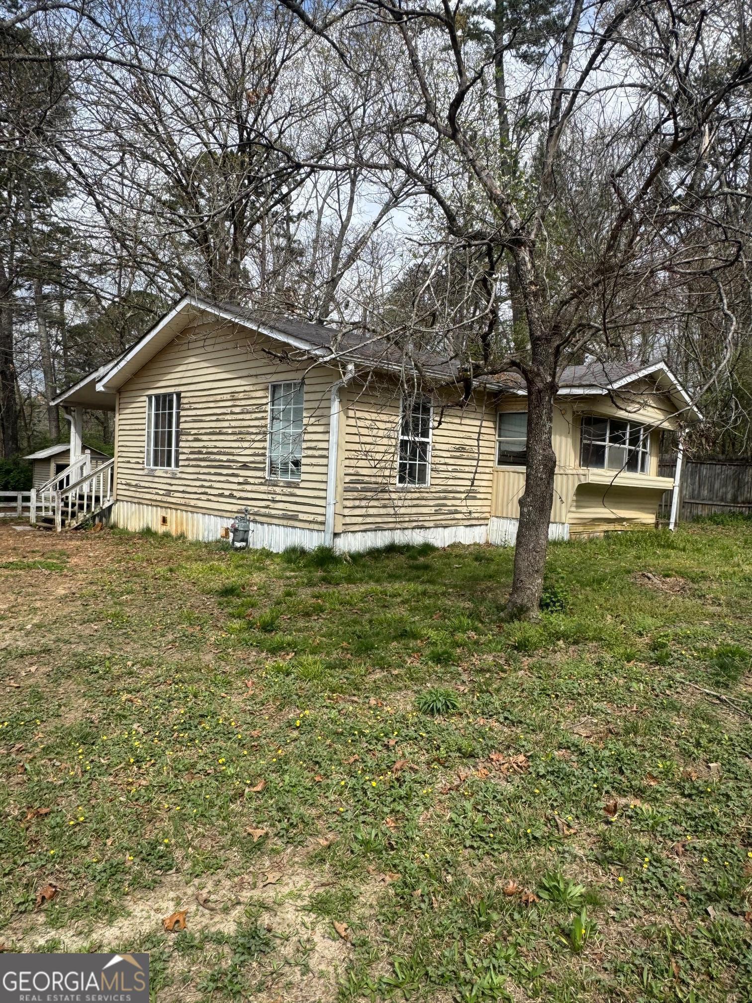 1573 Ray Mountain Road Jasper, GA 30143 - Photo 1 of 1 a front view of a house with a garden