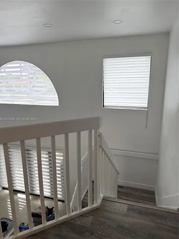 a view of entryway with wooden floor
