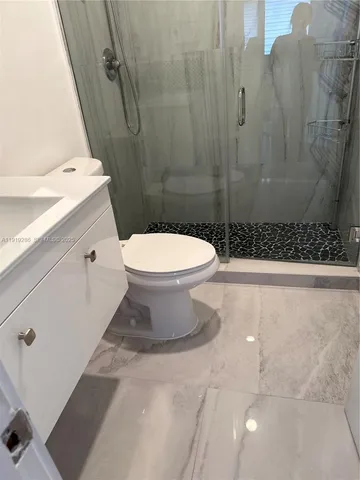 a bathroom with a toilet and a sink
