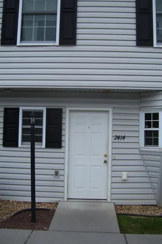 a view of a house and white door