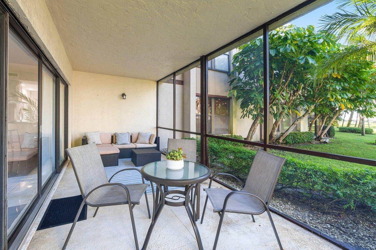 13380 Polo Road West, Unit A105 Wellington, FL 33414 - Photo 24 of 27 Covered Screened Patio