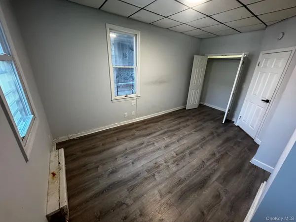 a view of an empty room with a window