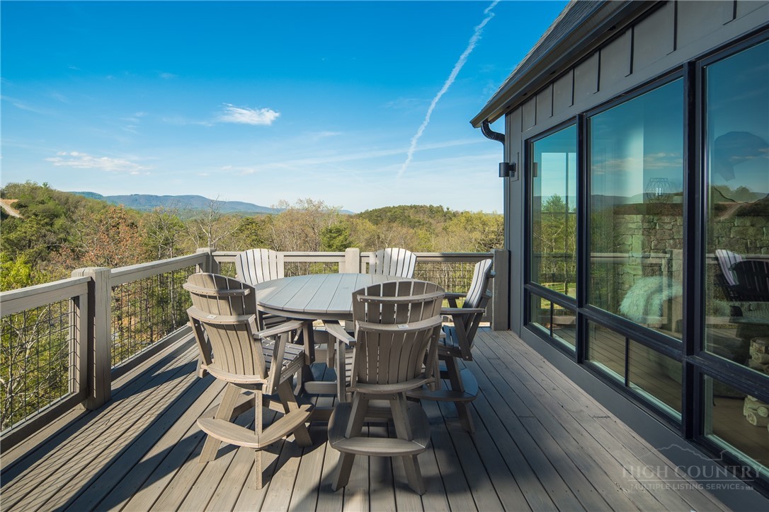 359 Calico Court Boone, NC 28607 - Photo 10 of 50 a view of a balcony with mountain view and wooden floor
