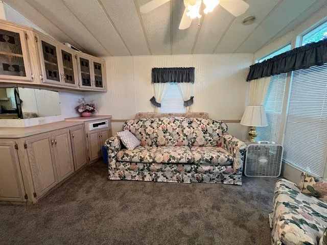 a kitchen with a refrigerator and a table