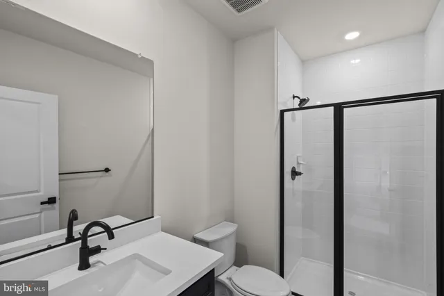 a view of a porch with wooden floor and fence