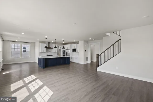 a view of kitchen with wooden floor