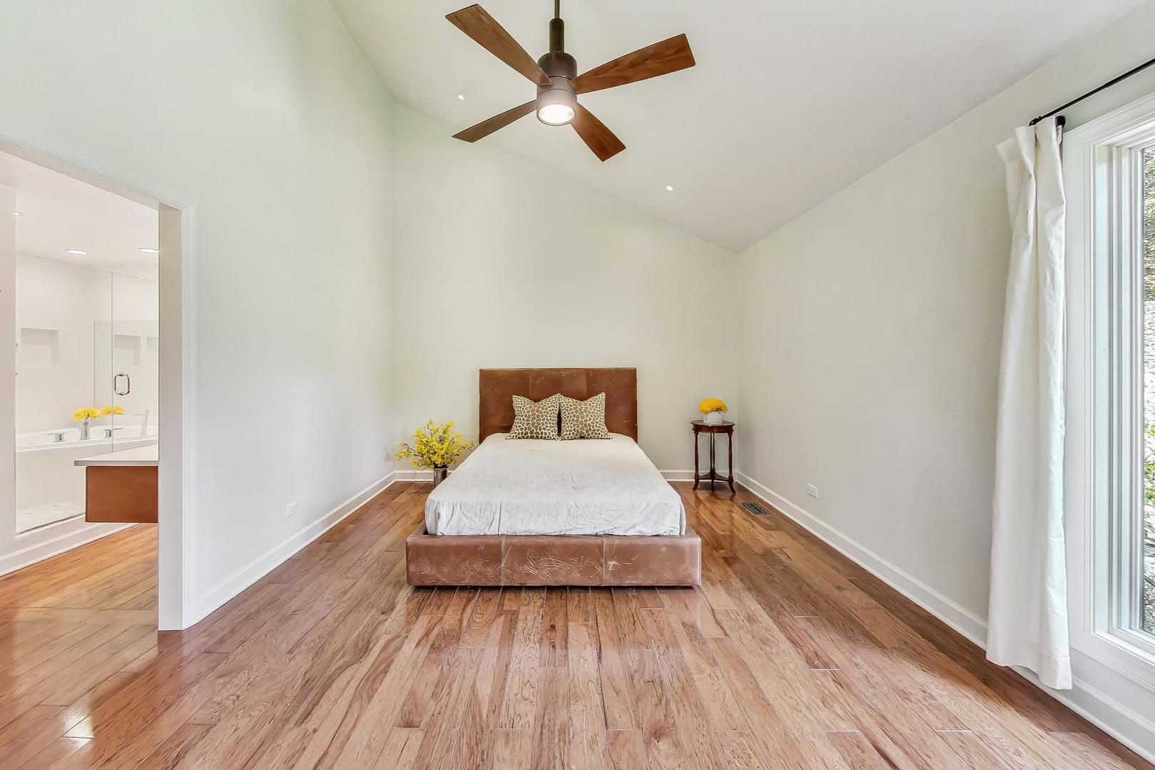 1169 Brighton Road Naperville, IL 60563 - Photo 17 of 54 a bedroom with a bed and wooden floor
