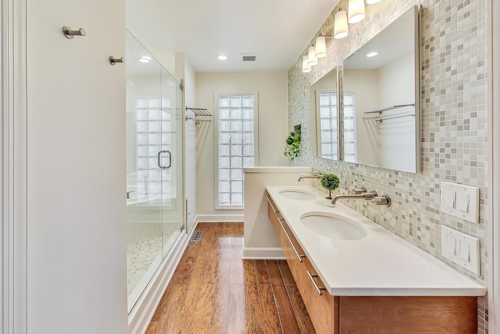 1169 Brighton Road Naperville, IL 60563 - Photo 19 of 54 a bathroom with a tub sink and mirror