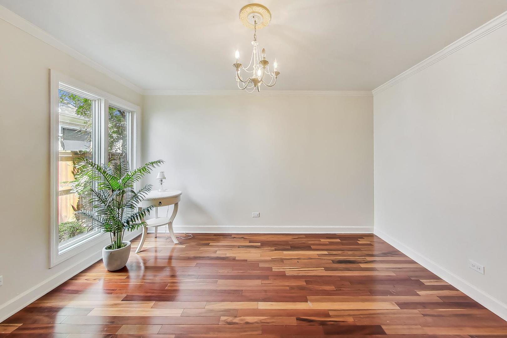 1169 Brighton Road Naperville, IL 60563 - Photo 24 of 54 a view of wooden floor chandelier and glass door