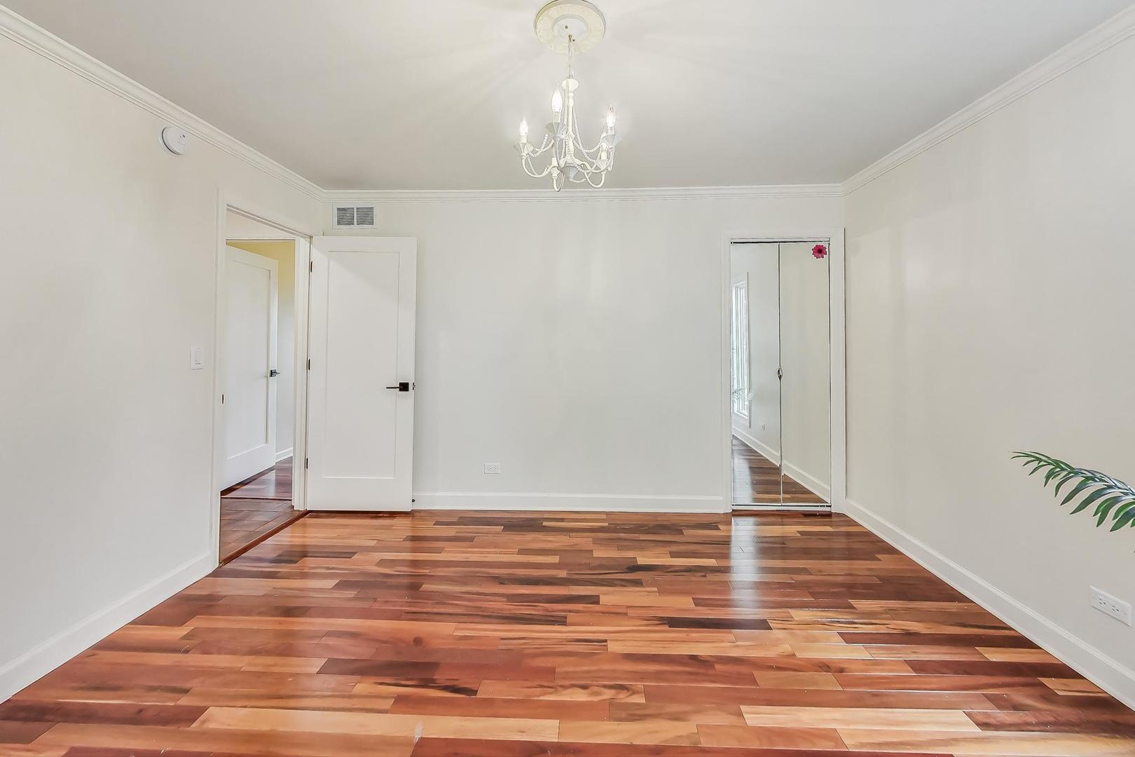 1169 Brighton Road Naperville, IL 60563 - Photo 25 of 54 a view of an empty room with wooden floor