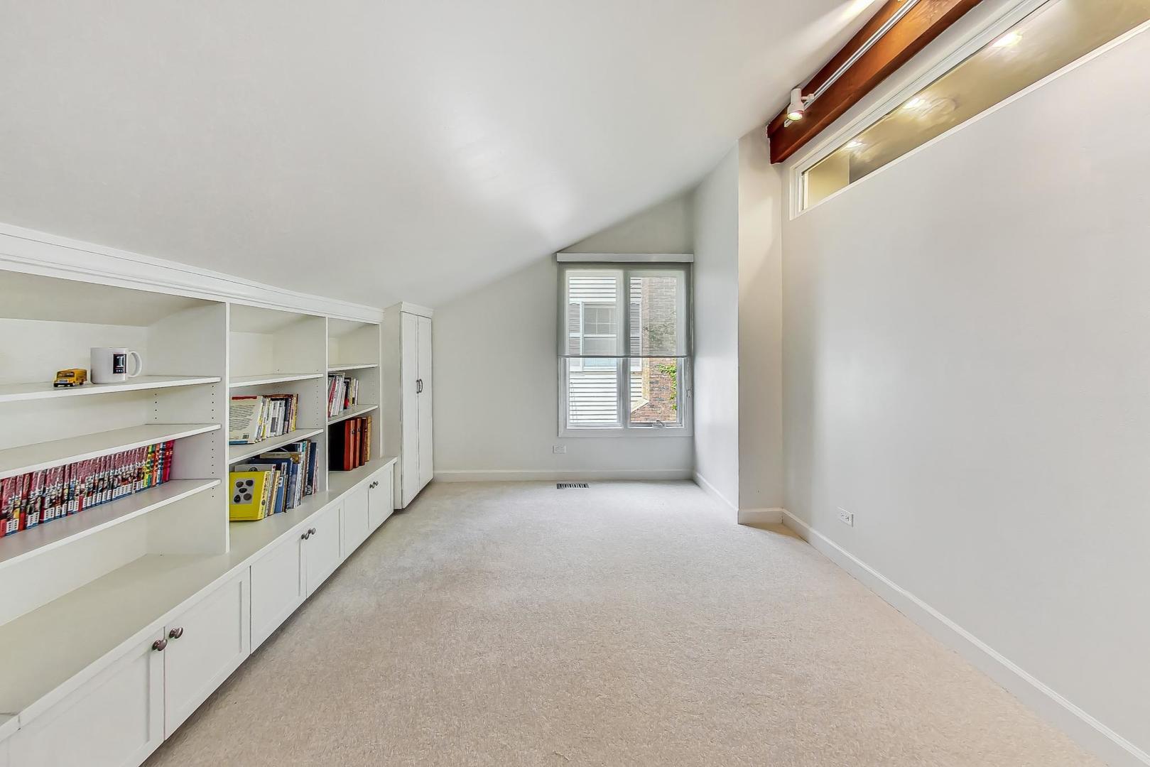 1169 Brighton Road Naperville, IL 60563 - Photo 31 of 54 a view of an empty room with window and refrigerator