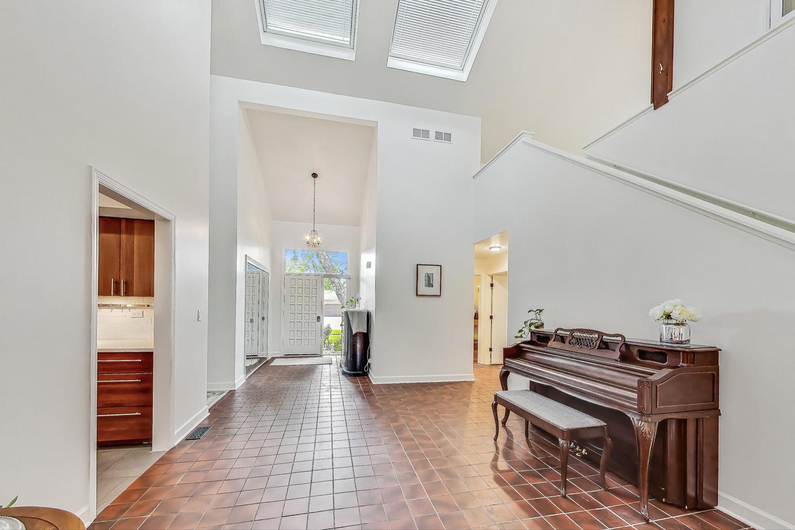 1169 Brighton Road Naperville, IL 60563 - Photo 4 of 54 a view of a hallway with workspace and a window