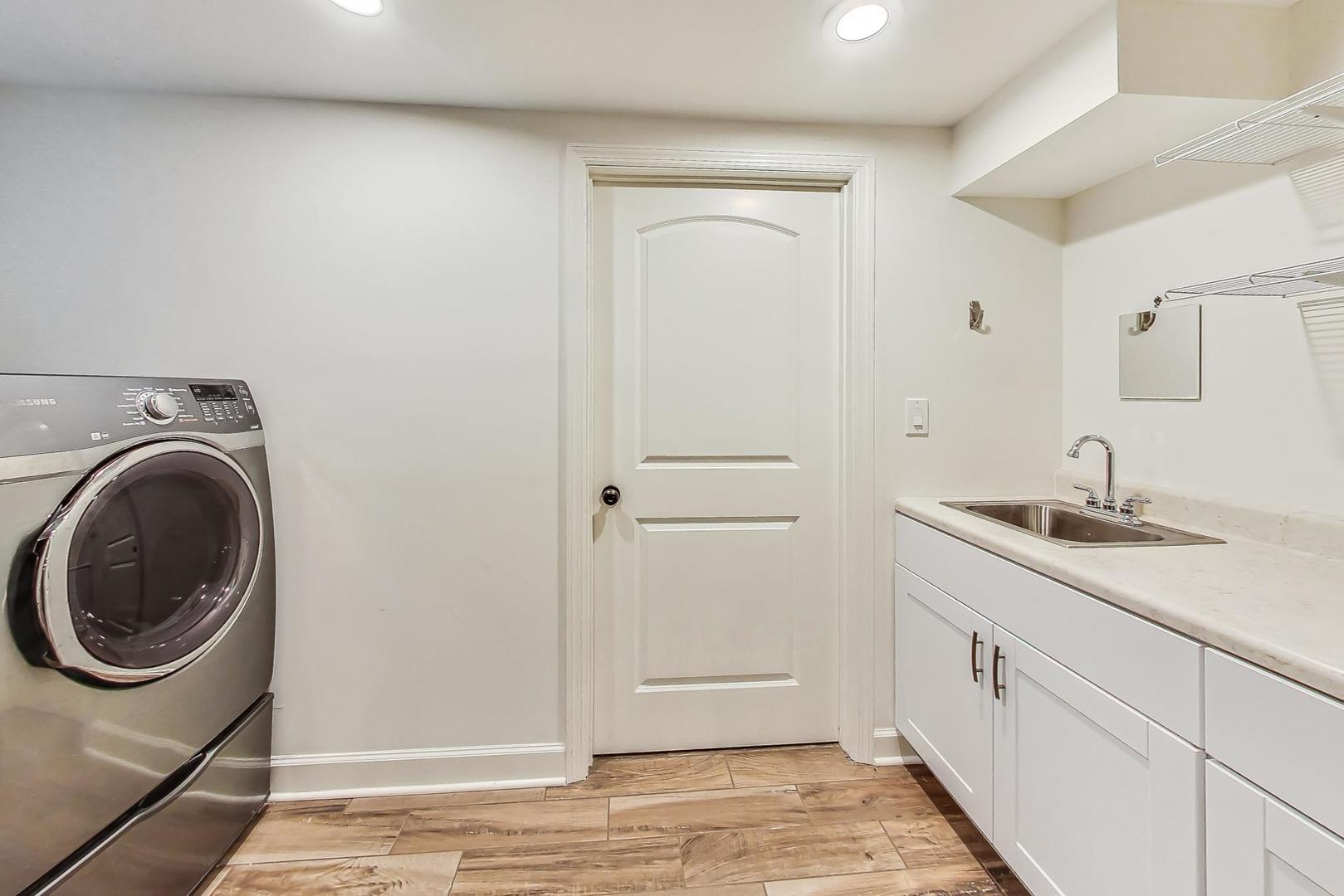 1169 Brighton Road Naperville, IL 60563 - Photo 41 of 54 a view of a kitchen with sink washer and dryer