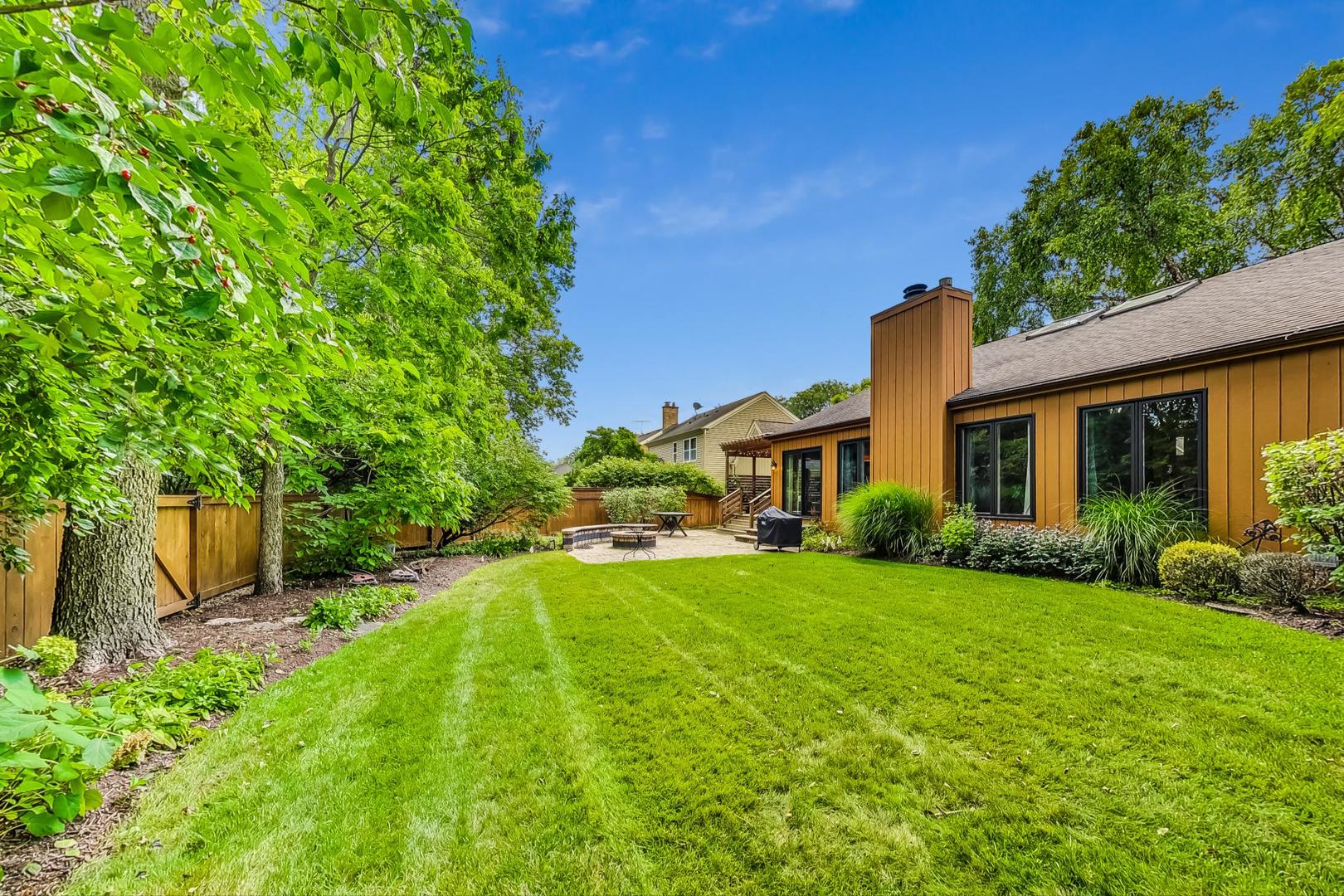 1169 Brighton Road Naperville, IL 60563 - Photo 48 of 54 a view of a house with a big yard potted plants and large tree