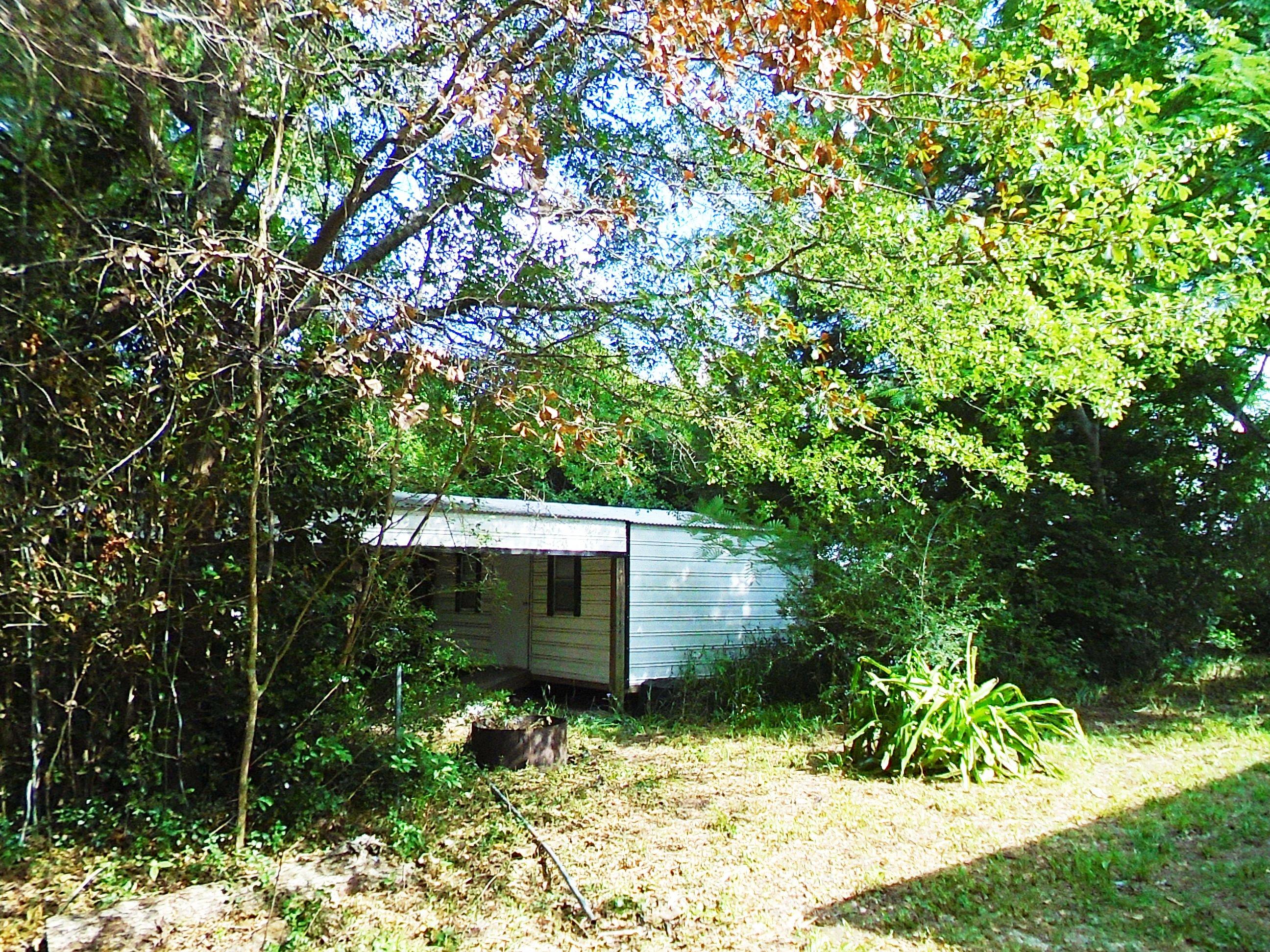 2928 Punch Bowl Road DeFuniak Springs, FL 32433 - Photo 13 of 17 a front view of a house with a yard