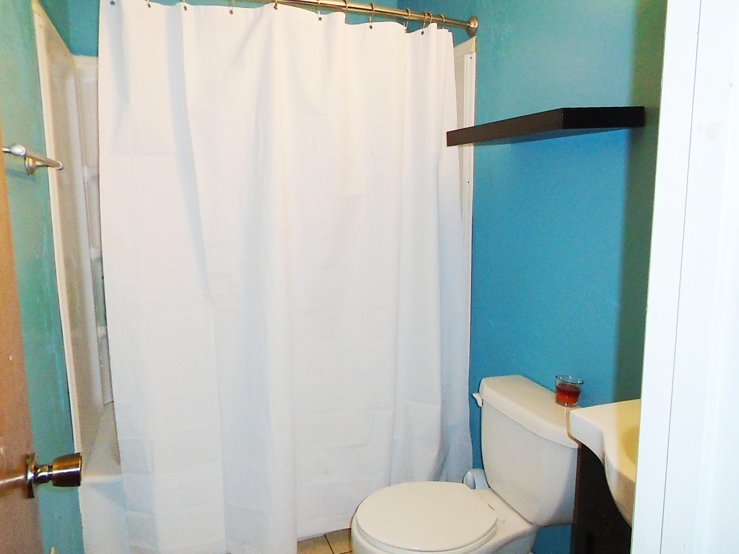 2928 Punch Bowl Road DeFuniak Springs, FL 32433 - Photo 10 of 17 a white toilet sitting next to a small bathroom