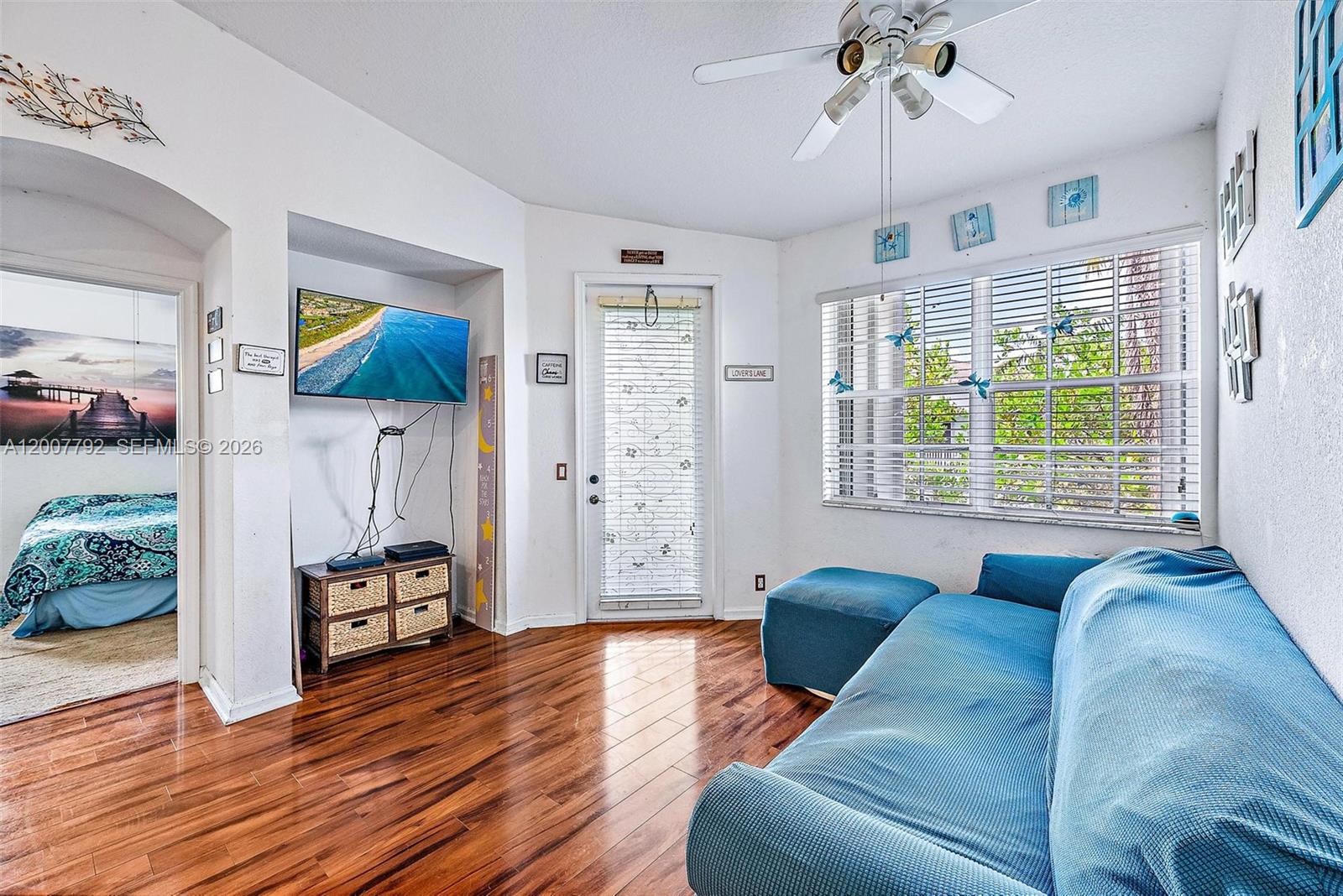 3229 Laurel Ridge Circle, Unit 3229 Riviera Beach, FL 33404 - Photo 8 of 24 a living room with furniture and a large window