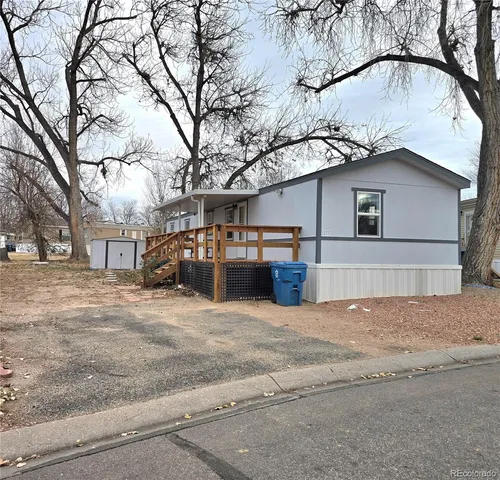 a view of a house with a snow in the road