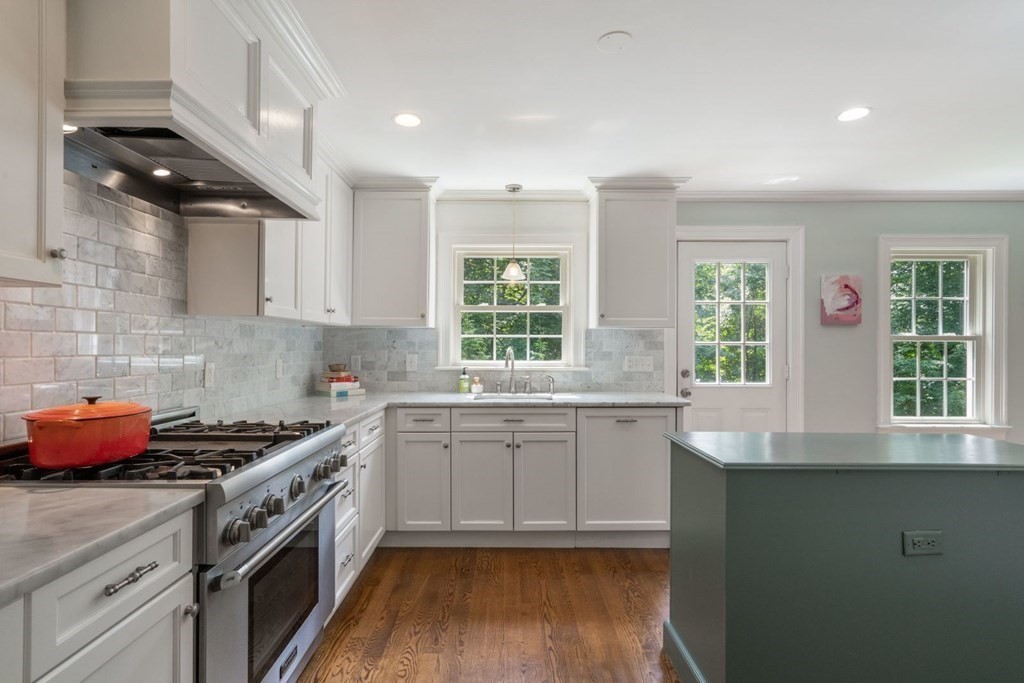 20 Chatham Circle Wellesley, MA 02481 - Photo 12 of 30 a kitchen with stainless steel appliances granite countertop a sink a stove and a wooden floors