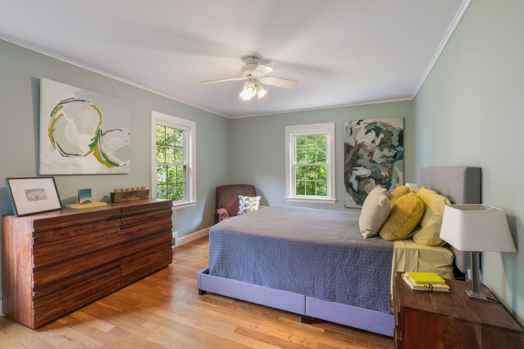 20 Chatham Circle Wellesley, MA 02481 - Photo 19 of 30 a bedroom with a bed and dresser with mirror